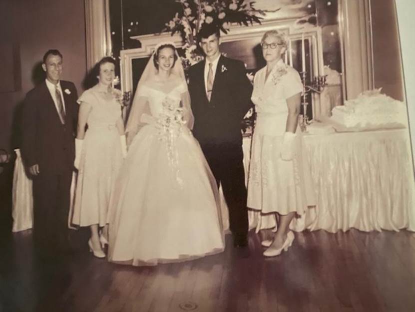 A group of people standing together
Description automatically generated